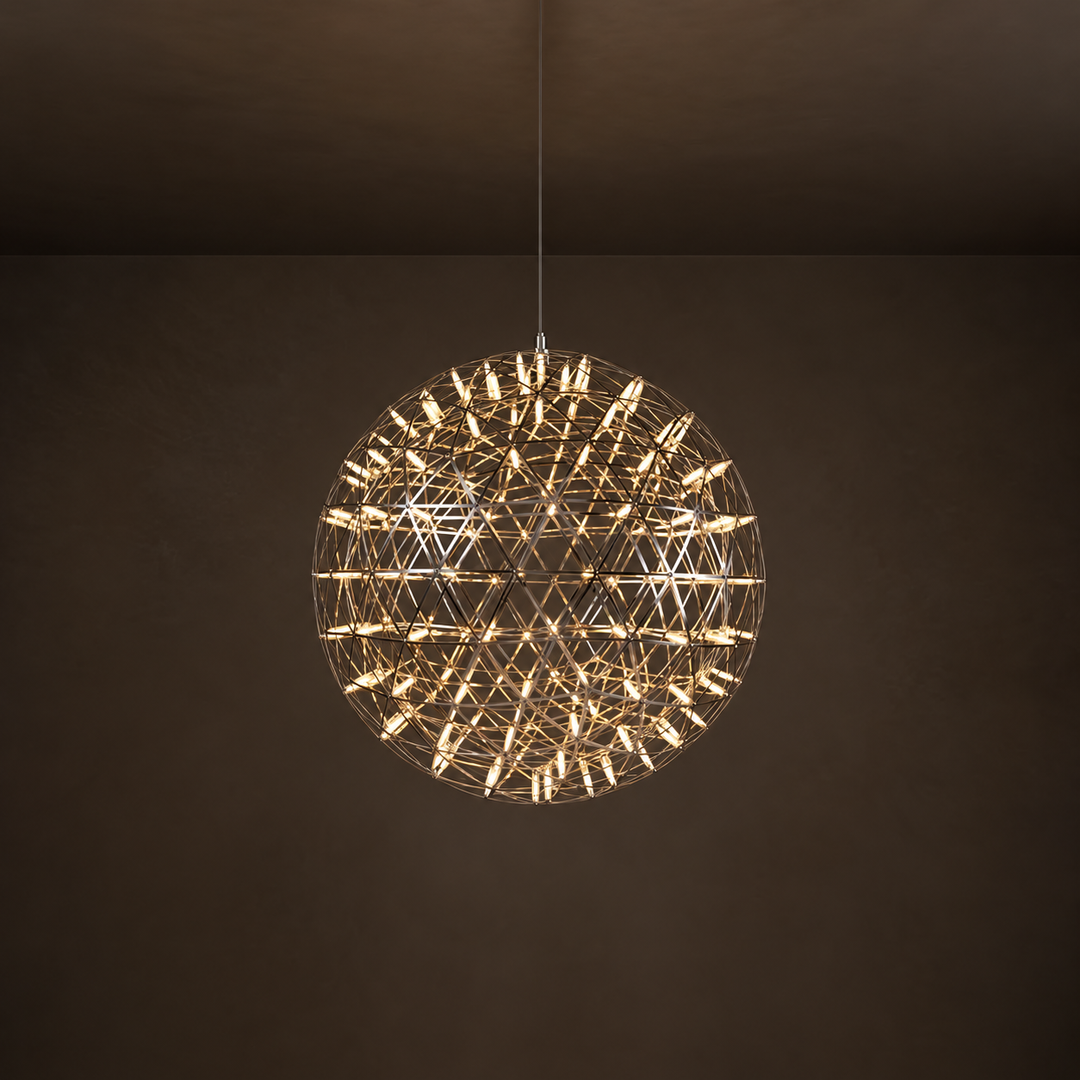 Spherical pendant light with a reflective metal lattice and glowing tubes hangs from a thin cable against a dark brown background.