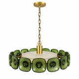 A modern multi-light pendant chandelier featuring textured green glass circular shades and a central white textured shade, suspended by a gold-toned chain and canopy.
