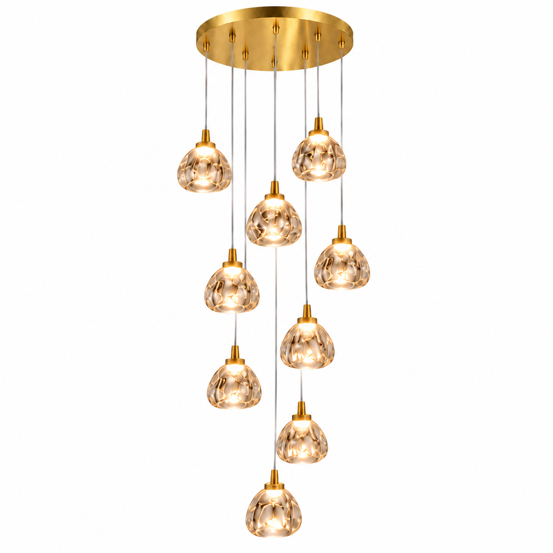 A modern multi-light linear chandelier with a brushed gold ceiling canopy and nine cascading glass pendant shades, shown against a solid white background.