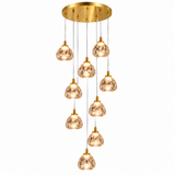 A modern multi-light linear chandelier with a brushed gold ceiling canopy and nine cascading glass pendant shades, shown against a solid white background.