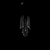 A modern chandelier with multiple clear glass or acrylic rods hanging from a dark ceiling mount against a solid black background.