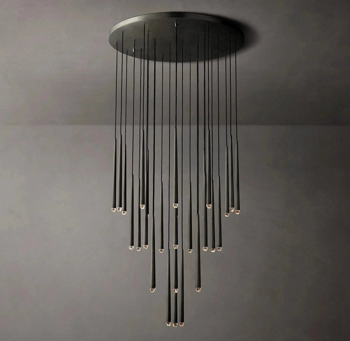 Modern black chandelier against a gray wall