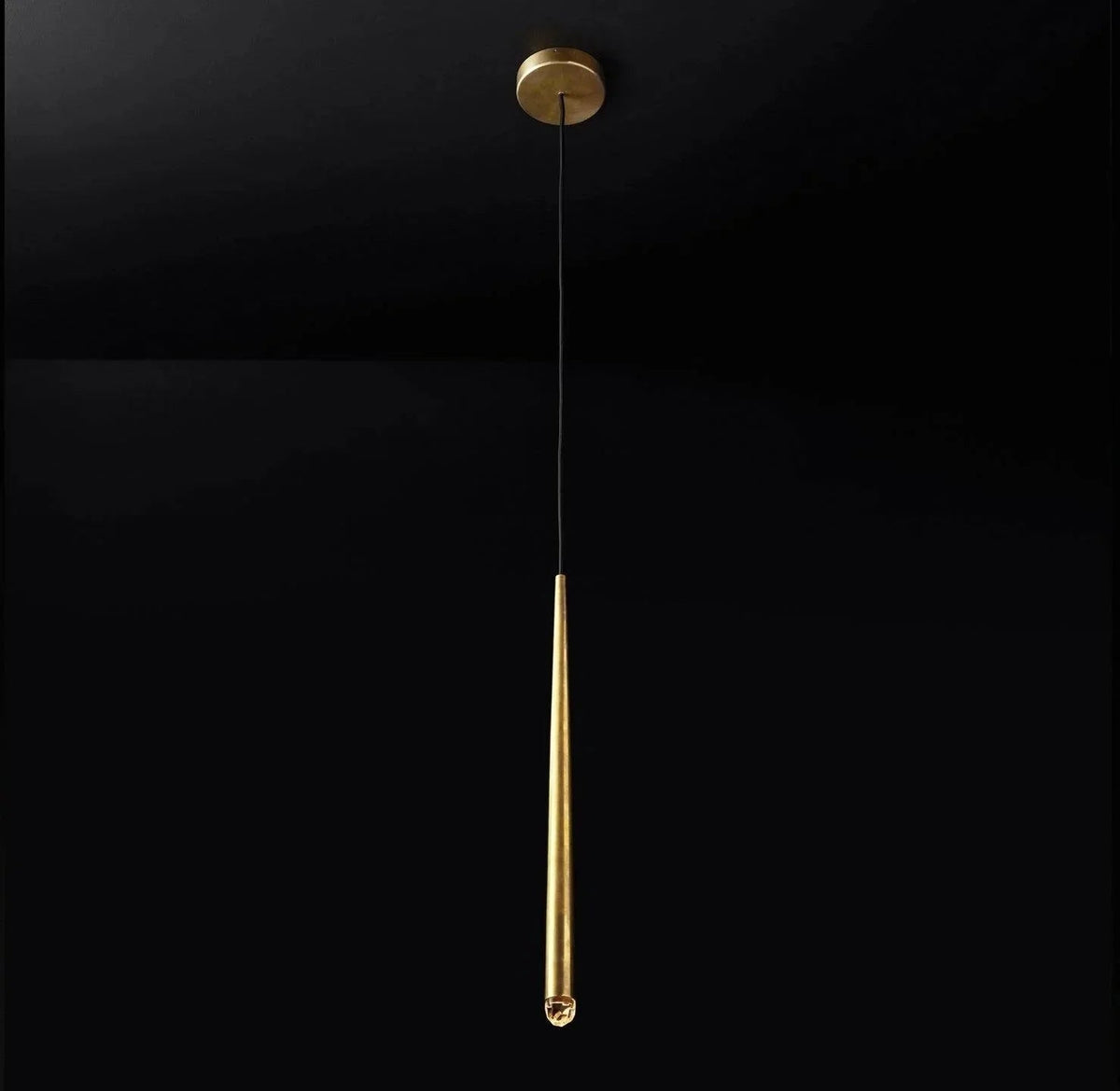 Chandelier shown with a single tapered brass tube, crystal tip, black cord and matching round canopy against a black background.