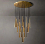 A modern chandelier with a circular gold ceiling mount, multiple black hanging cords, and tapered gold glass shades arranged in a cascading fan pattern against a dark gray wall.