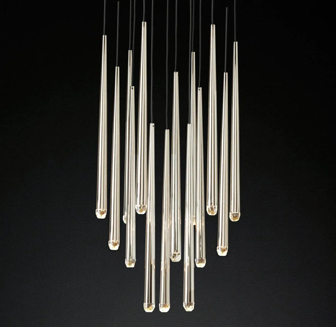 A modern chandelier featuring multiple clear glass teardrop-shaped pendant lights suspended from black cords against a solid black background.