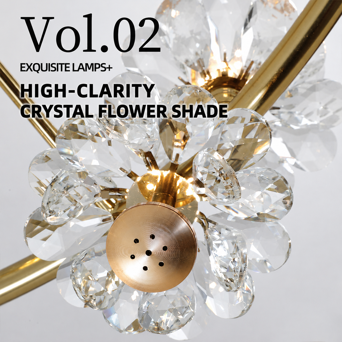 Close-up of the gold chandelier with clear faceted crystal flower petals and gold centers against a light gray background.