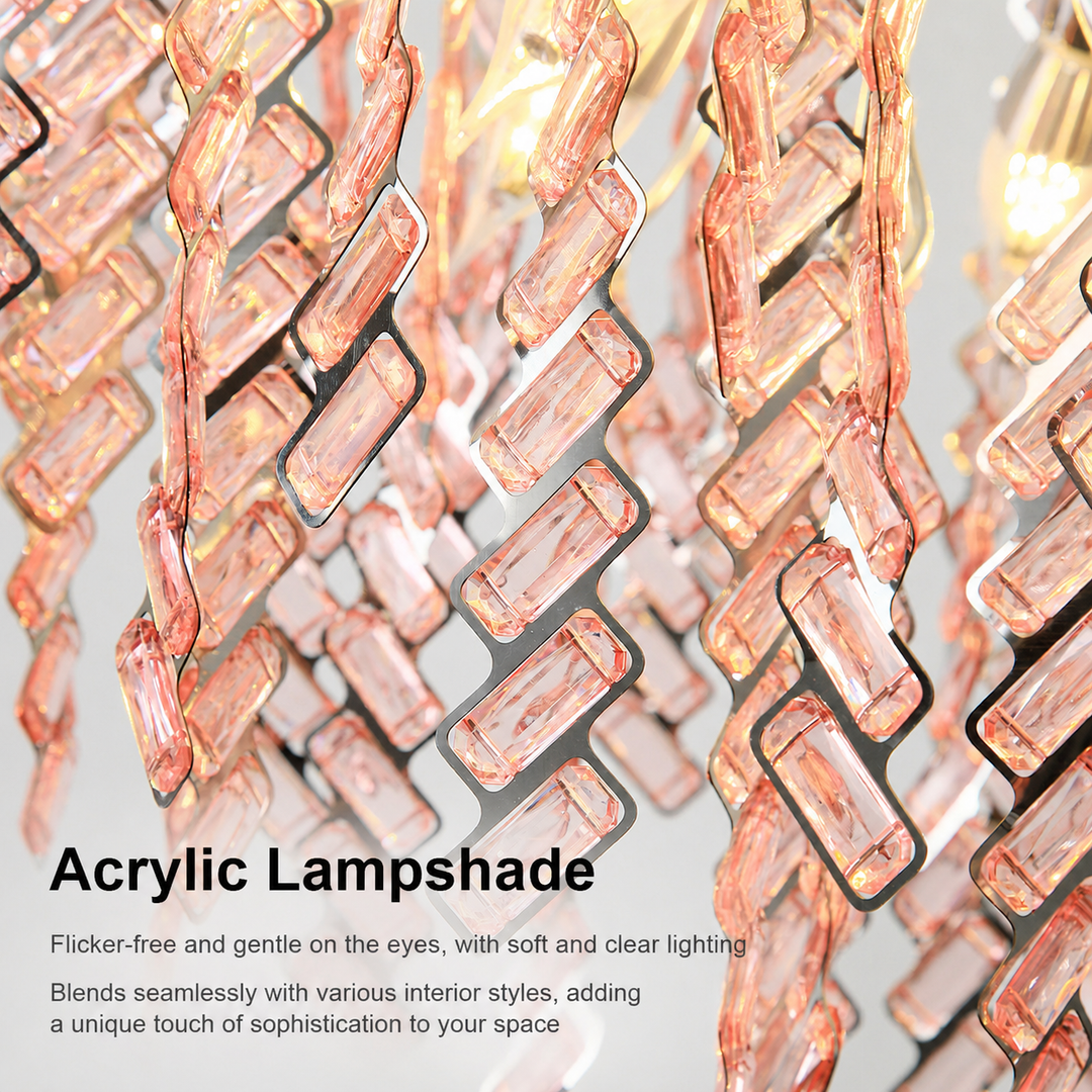 Close-up of the chandelier’s pink acrylic prism fringe with warm light glowing through the pieces against a light gray background.