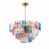 A multi-light chandelier featuring multiple rectangular glass shades in blue, red, and clear glass, suspended from a gold-toned chain and ceiling canopy against a white background.
