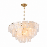 A modern multi-light chandelier featuring irregular, textured clear glass or acrylic pendants suspended from a brushed gold-tone chain and canopy, shown against a plain white background.