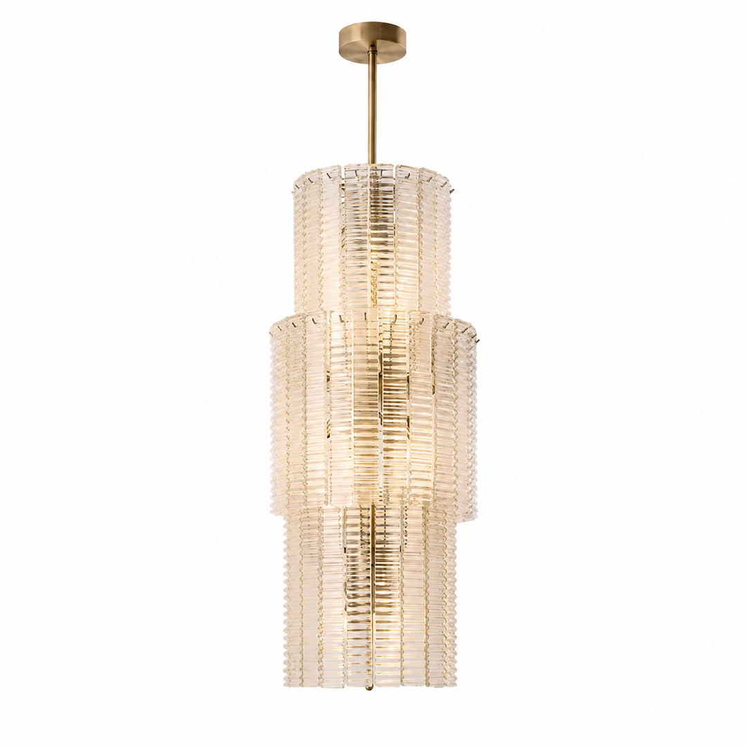 A modern multi-tiered pendant chandelier with a brushed gold finish and clear ribbed glass shades, shown against a plain white background.