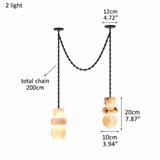 A two-light pendant chandelier with black metal chains and organic-shaped warm white stone shades, shown on a white background with dimension labels and text indicating total chain length 200cm and individual shade heights.