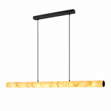 A modern linear pendant light with a warm yellow-orange marbled stone or acrylic shade and a matte black ceiling canopy and suspension rods, shown against a plain white background.