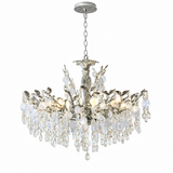 A multi-light crystal chandelier with a silver-toned metal frame, hanging chain, and cascading clear glass crystal drops on a white background.
