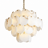 A modern chandelier featuring a cluster of oval white and cream marble discs that glow with warm light, suspended by a gold-toned chain against a solid white background.