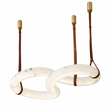 A modern two-light chandelier featuring interlocking oval white stone rings, brown leather cords, and brass cylindrical ceiling canopy fittings, shown against a solid white background.