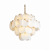 A modern chandelier featuring a cluster of oval white stone or resin pendants with subtle natural veining, suspended by a gold-toned chain against a solid white background.