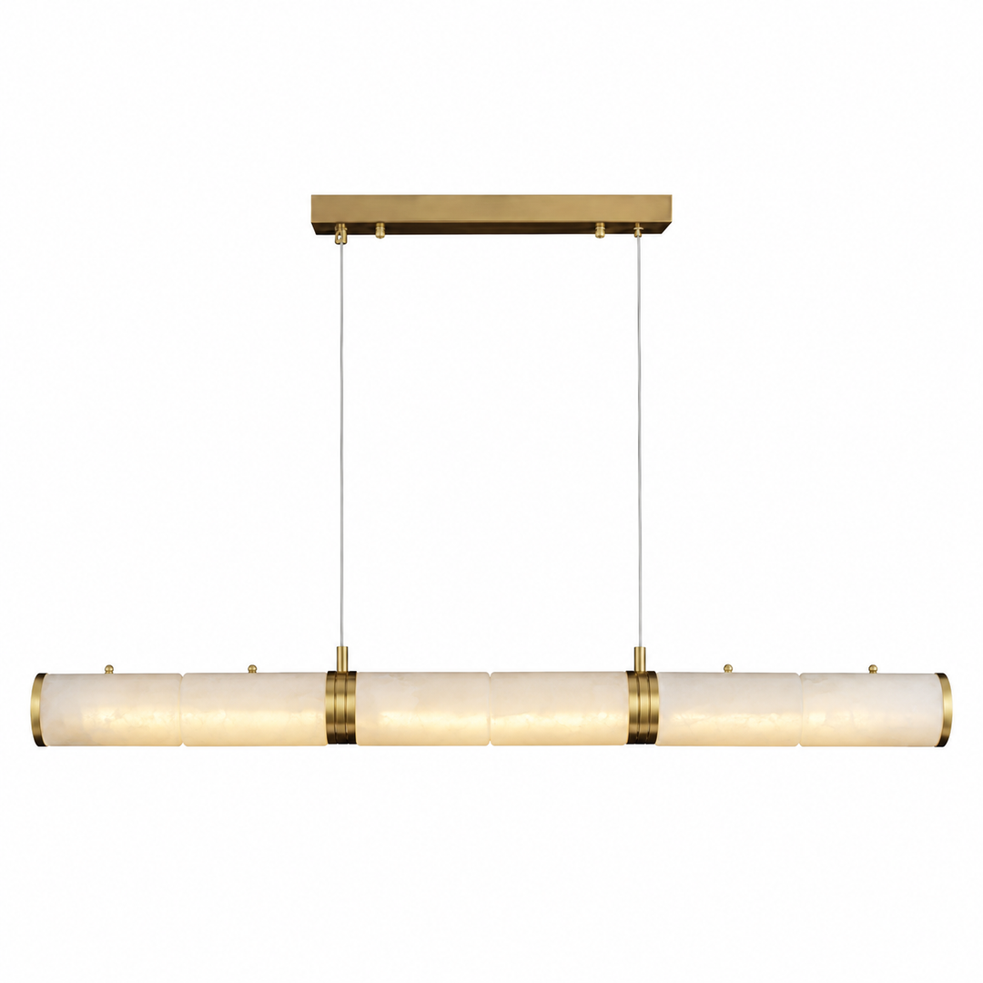 A modern linear pendant light fixture with a horizontal bar of textured, warm off-white glass shades and polished brass hardware, suspended by two thin cables from a matching brass ceiling canopy.