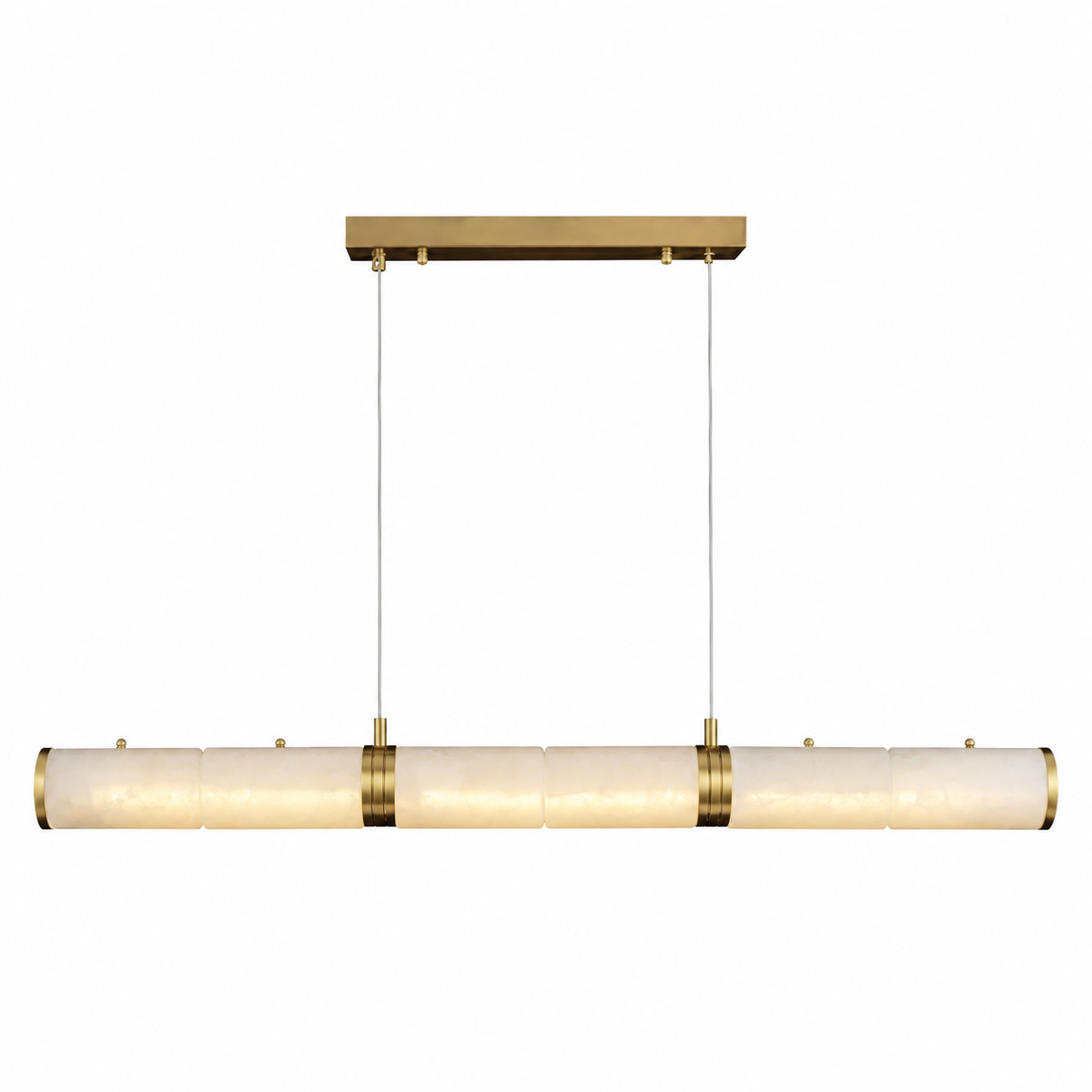 A modern linear pendant light fixture with a horizontal bar of textured, warm off-white glass shades and polished brass hardware, suspended by two thin cables from a matching brass ceiling canopy.