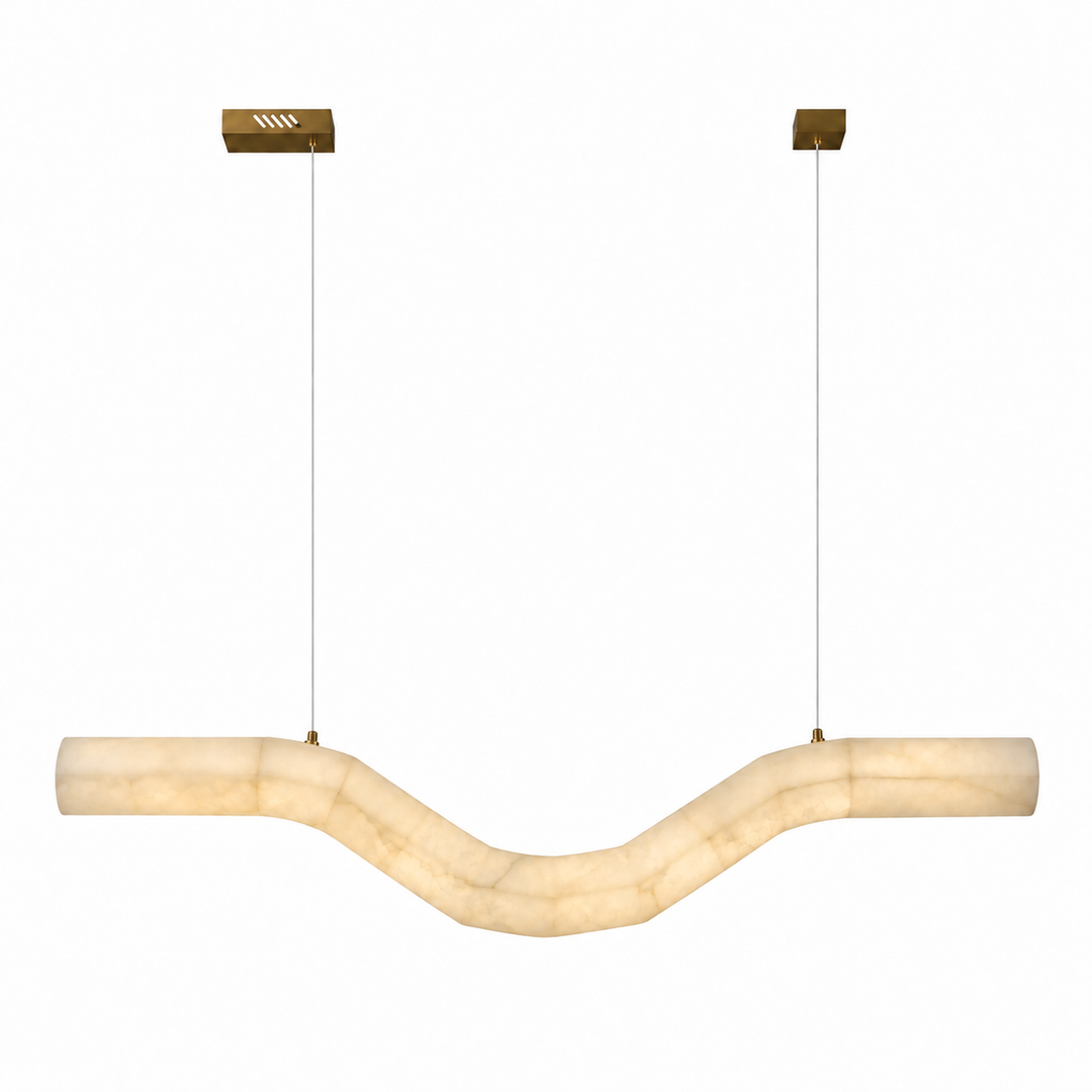 A modern U-shaped linear pendant light made of warm cream-colored stone, suspended by thin cables from two gold square ceiling mounts against a plain white background.