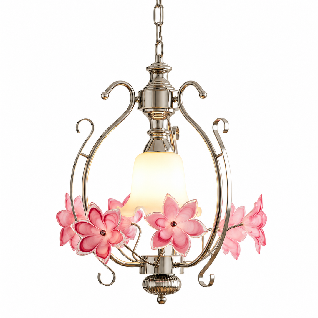 A hanging pendant light fixture with a brushed silver metal frame, a glowing warm white glass shade, and pink glass flower accents on each side, shown against a plain white background.
