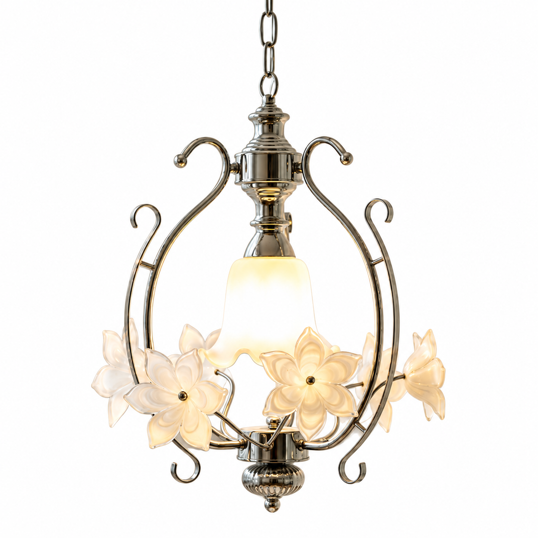 Pendant light with a silver-tone iron frame, cream glass flowers, and a glowing central shade against a white background.
