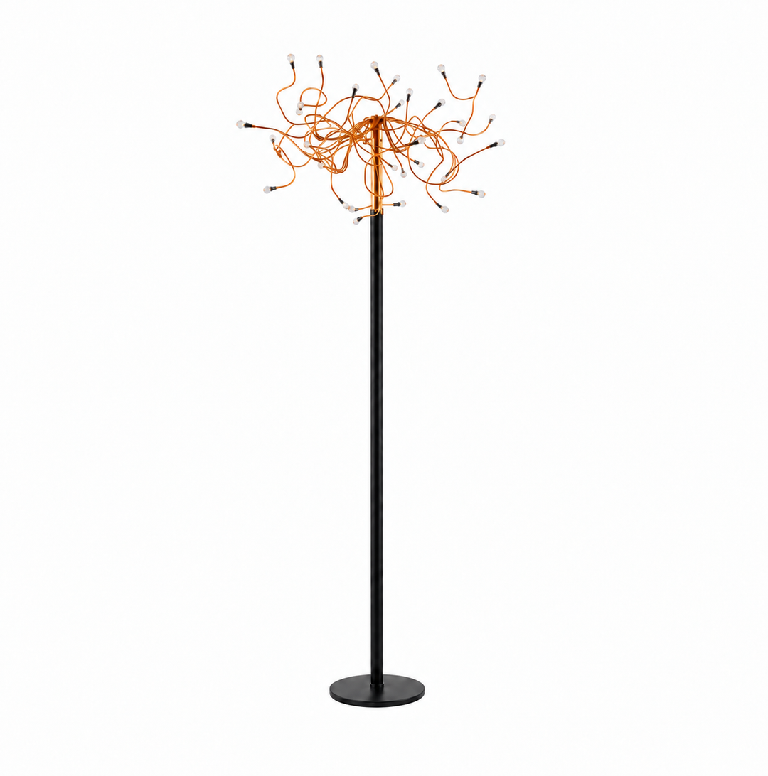 A modern floor lamp with a slim black pole and circular base, topped with a spherical cluster of orange wires or cords ending in small dark tips, shown on a plain white background.