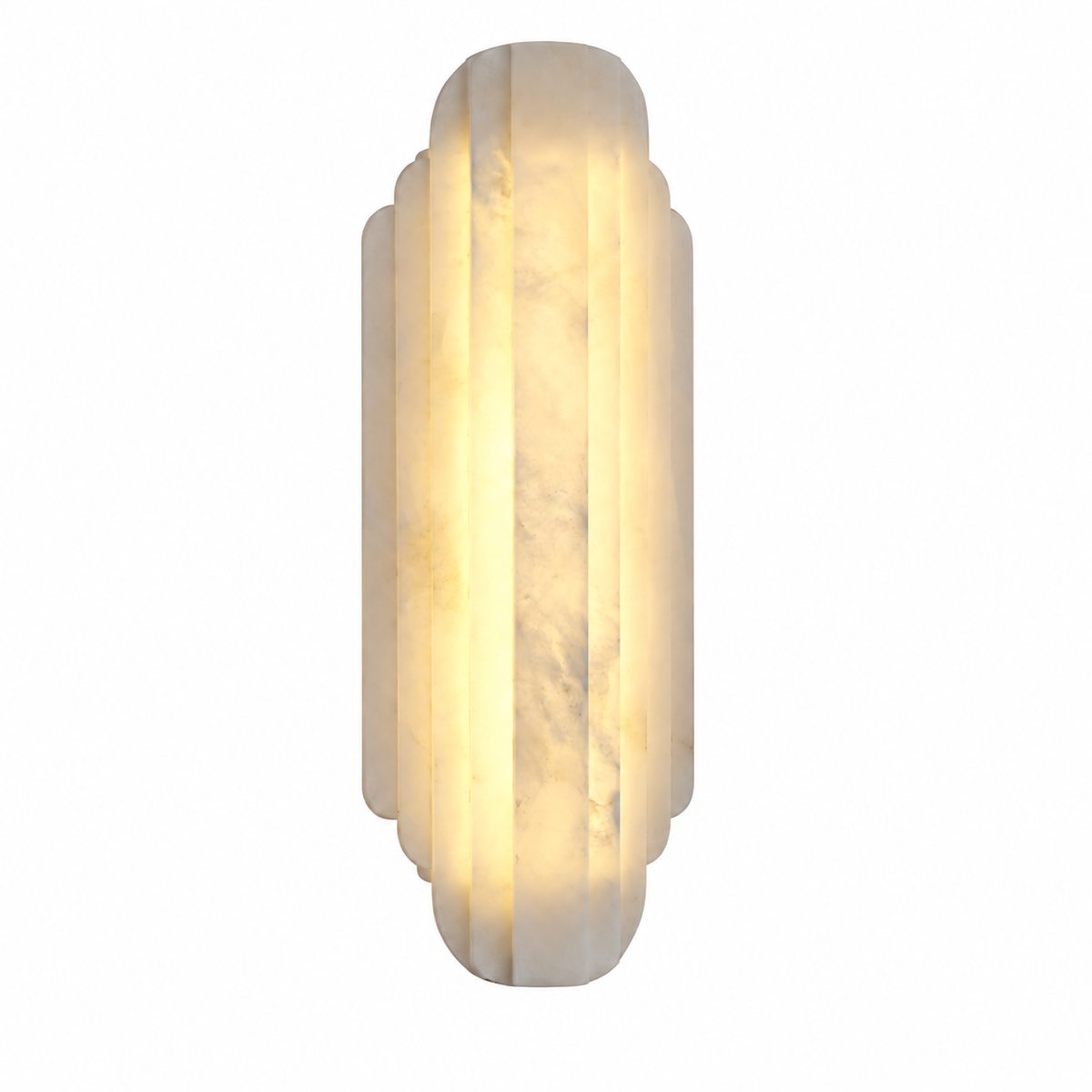A vertical wall sconce light fixture made of warm white marble with a fluted, tiered geometric design, glowing with a soft warm yellow light against a solid white background.