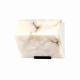 A single-light wall sconce with a cream alabaster shade, gray veining, and black support appears against a white background.
