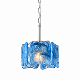 A modern pendant light with a textured, wavy blue glass shade and a polished silver metal chain and rod, shown against a solid white background.