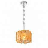 A modern pendant light with a textured, organic-shaped amber glass shade and a polished chrome chain and ceiling canopy, shown against a plain white background.