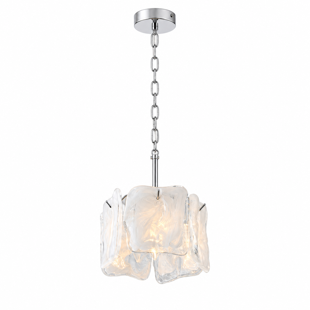 A modern pendant light fixture with a polished silver-tone chain and ceiling canopy, featuring a sculptural, organic-shaped clear glass shade that glows with warm light from within, shown against a solid white background.