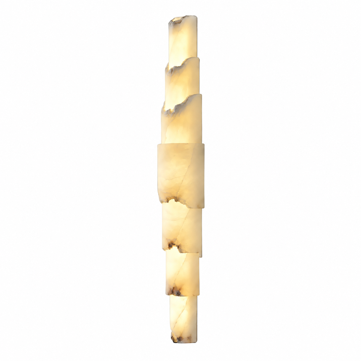 A modern vertical wall sconce made of stacked irregular rectangular stone sections, glowing with a warm cream and light brown marbled light against a plain white background.