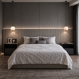 A matching pendant light pair with glowing white alabaster globes hangs above dark bedside tables in a gray paneled bedroom.