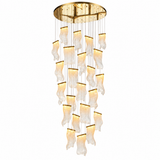 A modern multi-light chandelier with a circular gold ceiling mount, featuring multiple cascading tiers of textured, wavy clear glass shades that glow with warm light, suspended by thin gold wires against a solid white background.