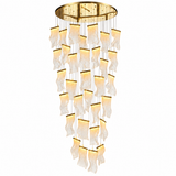 A modern multi-light chandelier with a gold circular ceiling canopy and multiple cascading, wavy glass shades that glow with warm light, shown against a plain white background.