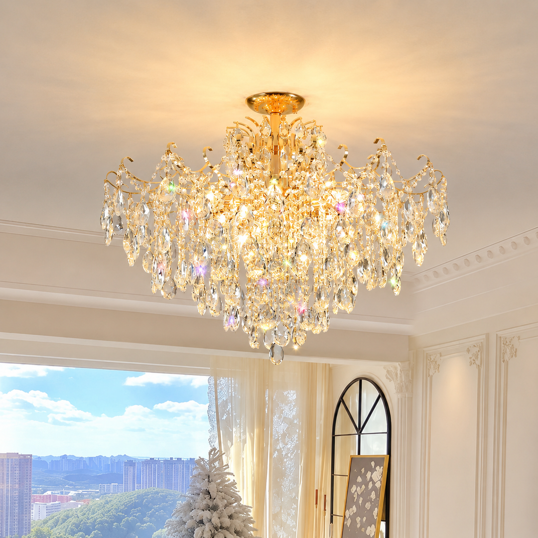 Luxurious crystal chandelier in a room with large windows and a view of trees.