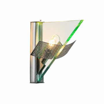 Illuminated wall sconce with a silver cylindrical mount, green-edged triangular glass panel, and folded perforated metal shade against a white background.