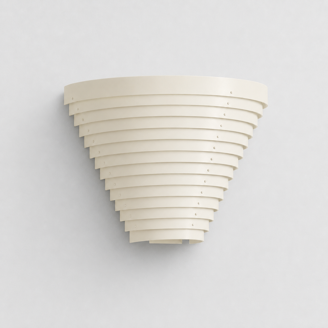 White steel wall sconce with layered curved slats tapering downward, mounted on a light grey wall.