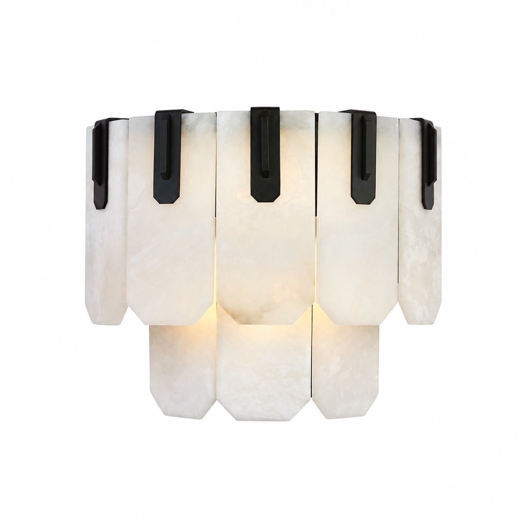 Illuminated wall sconce with two tiers of white stone panels and black iron brackets against a white background.