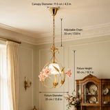 Gold pendant light with pink glass flowers hangs in a cream room, with labels showing 35 cm diameter and 50 cm height.