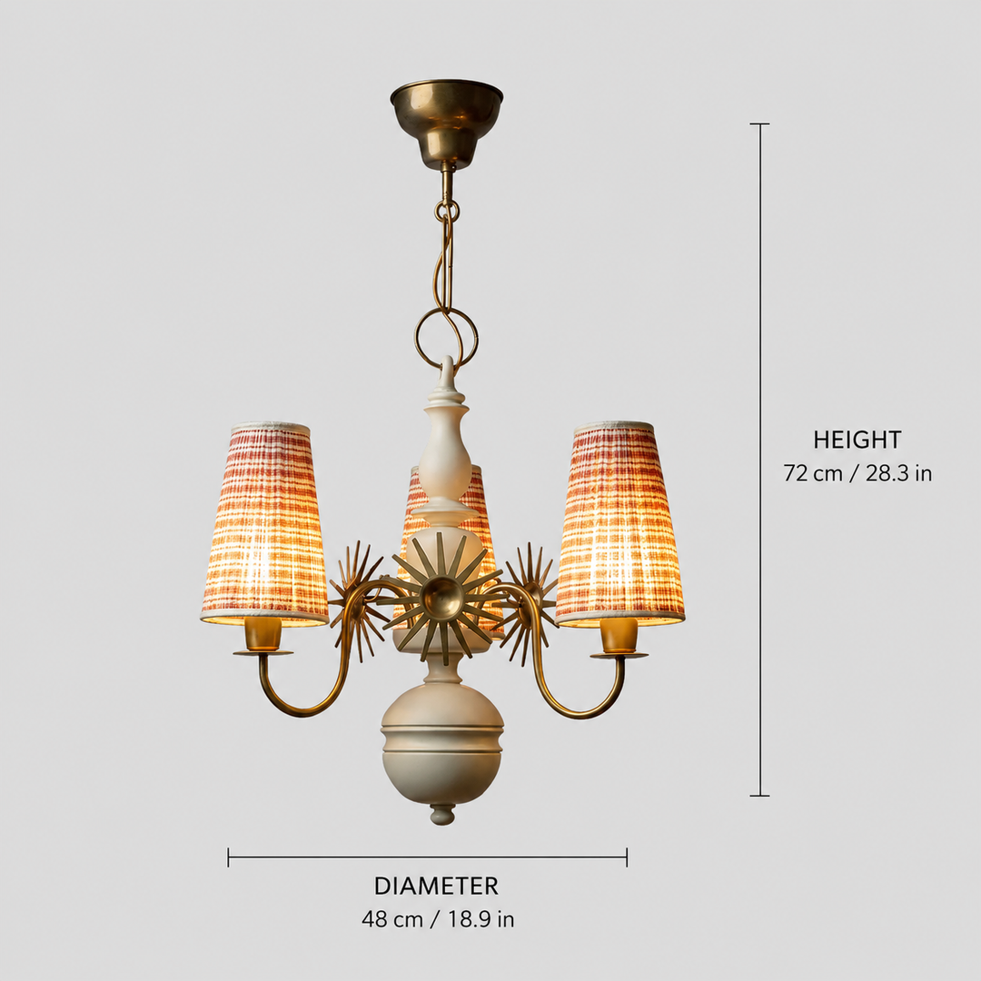 A three-light chandelier pendant lamp with a brass-finished metal frame, a central cream-colored vase, and three tapered fabric shades with a red, orange, and beige plaid pattern. The image includes dimension overlays indicating a height of 72 cm (28.