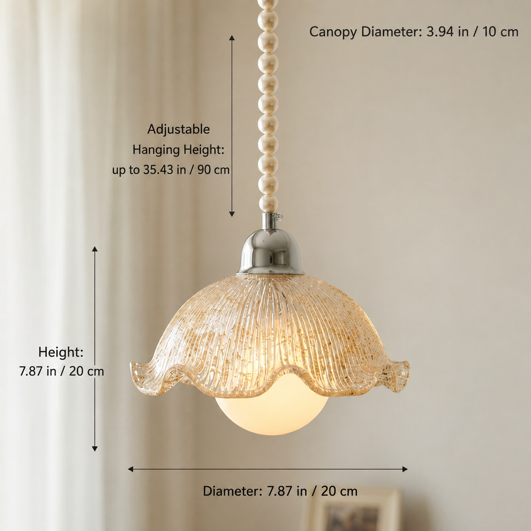 A pendant light with a textured glass shade, a pearl bead chain, and a silver metal cap, shown with dimension lines and text indicating canopy diameter, adjustable hanging height, and shade diameter.