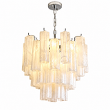 A modern multi-tier chandelier with clear glass cylindrical shades and a polished silver metal canopy and chain, shown illuminated against a plain white background.
