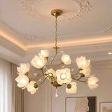 A brass multi-light chandelier with flower-shaped frosted glass shades, hanging from a decorative ceiling in an elegant room.