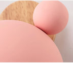 Macro of the pink iron shade, ear ball and wood grain