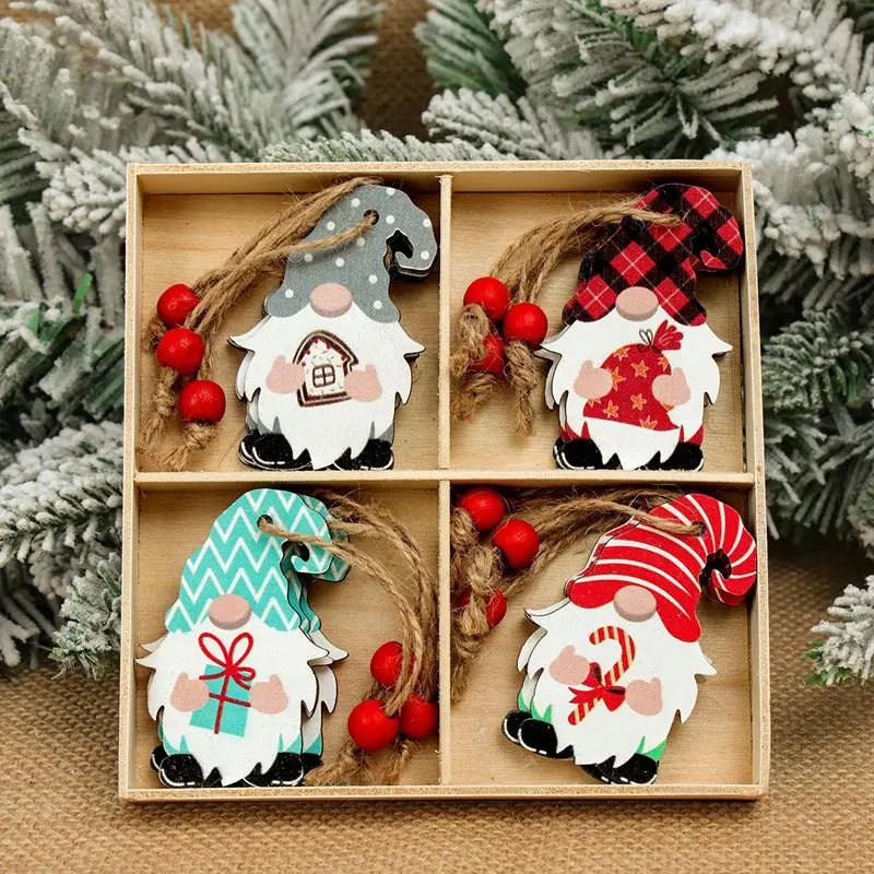 Wooden gnome Christmas ornaments with gray, turquoise, striped red, and plaid hats fill a divided box surrounded by frosted greenery.