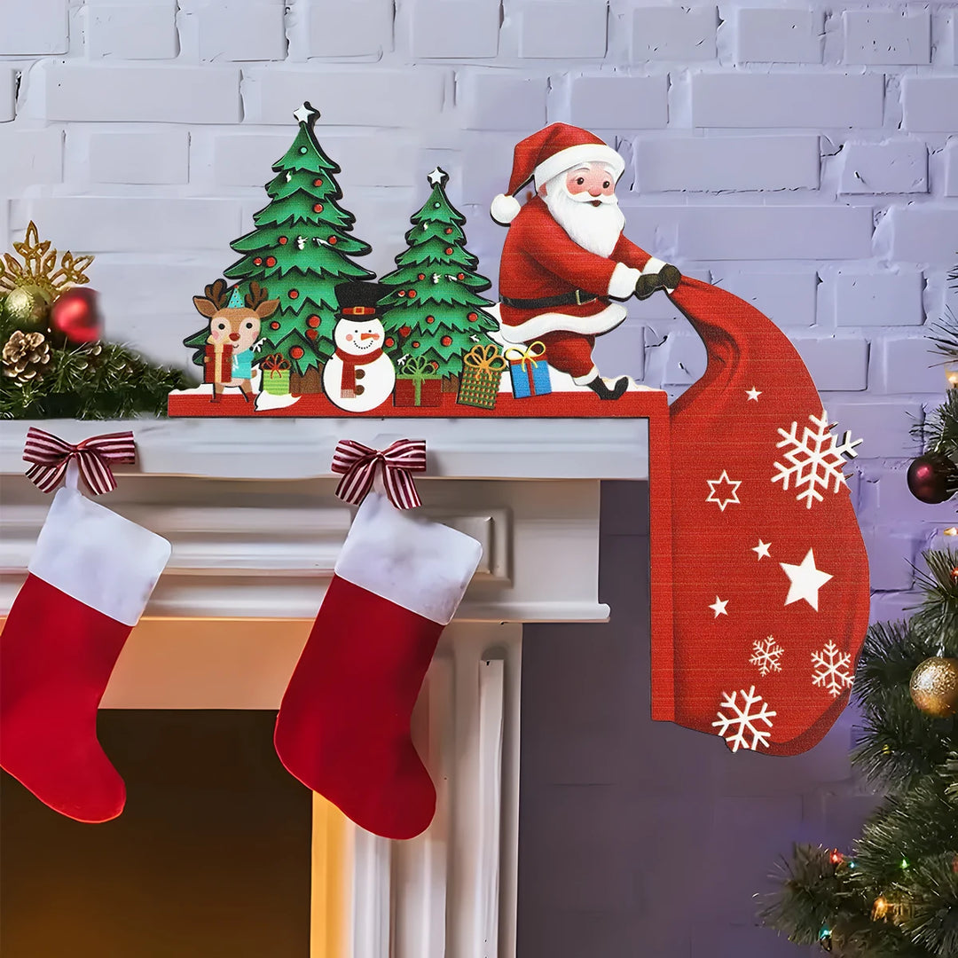 Santa door corner decoration with green trees, a snowman, reindeer and a red sack sits on a white mantel above red stockings.
