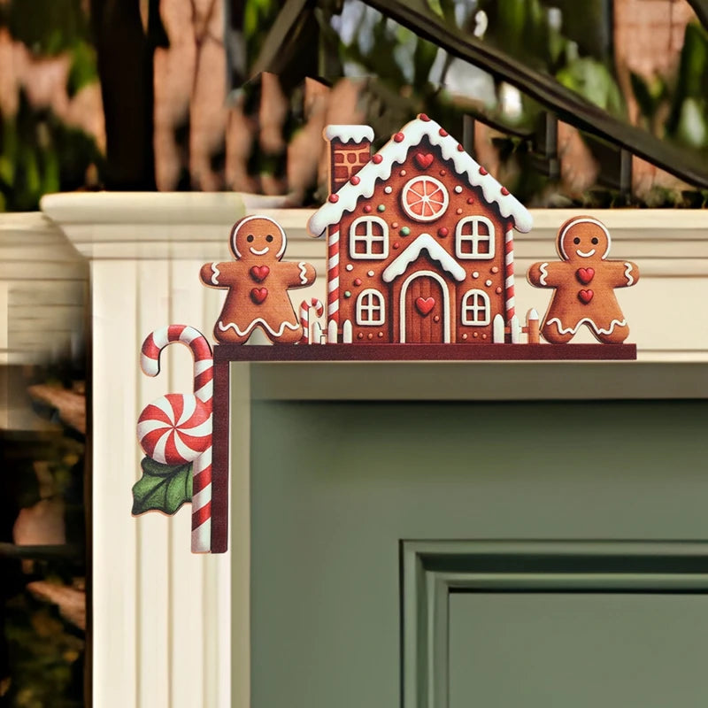Brown gingerbread house door corner decoration with two gingerbread figures and a striped candy cane rests on green door trim.