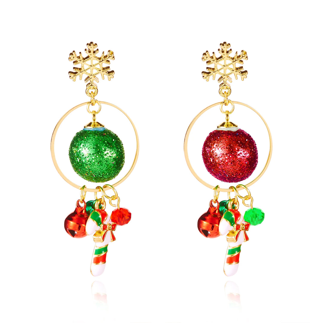 Snowflake drop earrings with gold-tone rings, green and red glitter balls, bells and striped candy cane charms appear against a white background.