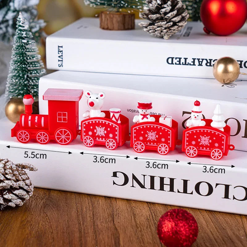 Red Christmas train decoration on a book with measurements displayed